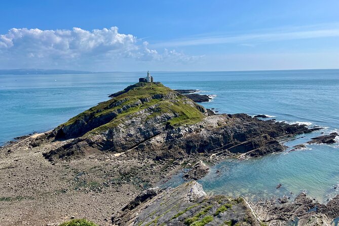 Cardiff: Gower Peninsula's Cliffs Scenic Day Tour - Mumbles first stop: shops, seafront air, and Norman castle ruins nearby